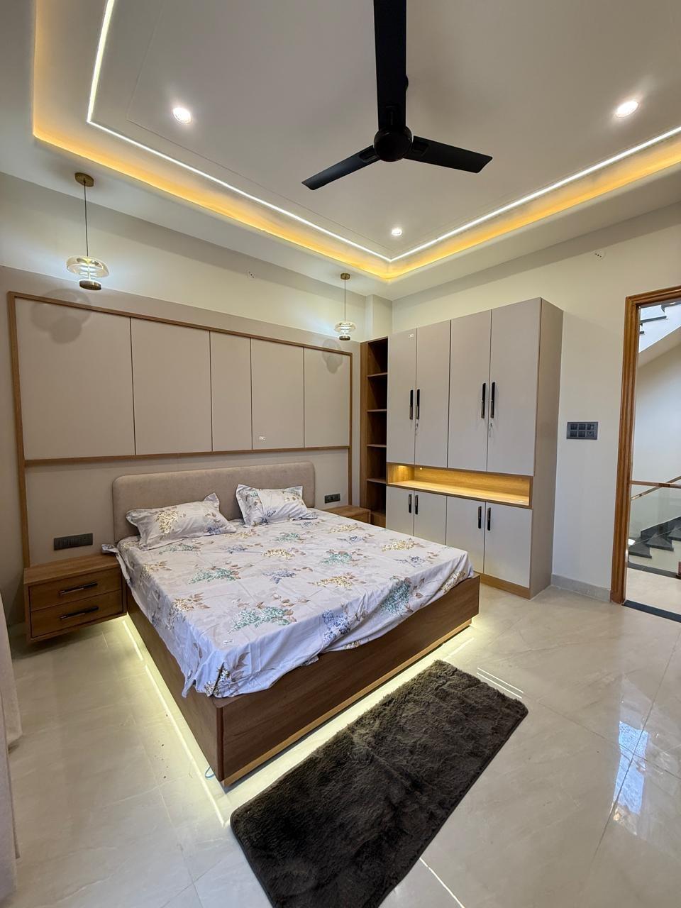 Bedroom with floating bed and cove lighting