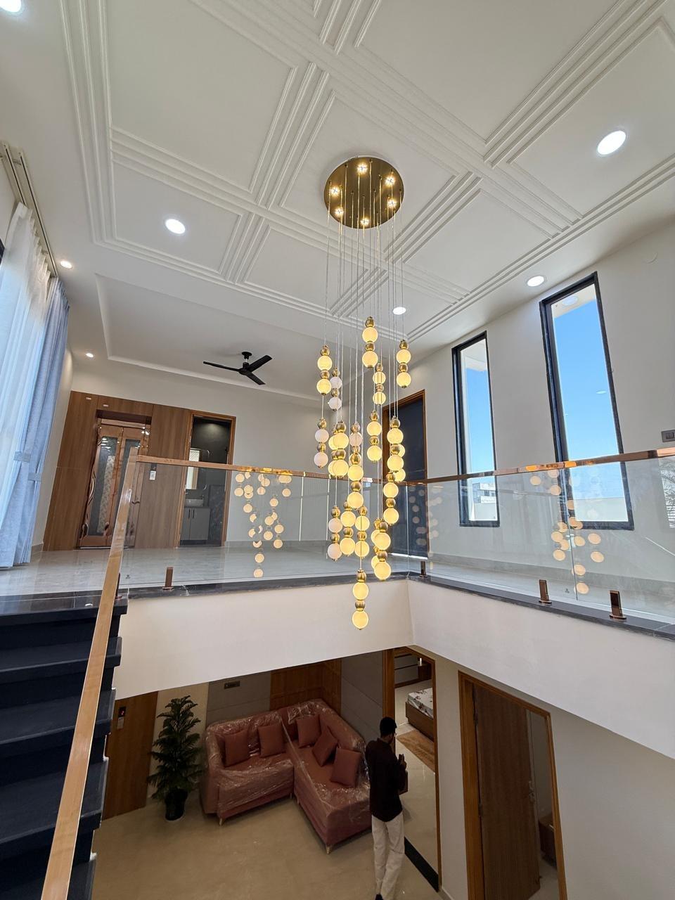 Double-height atrium with chandelier