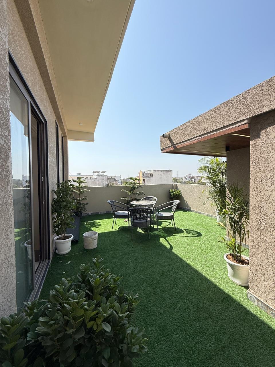 Terrace with lawn and outdoor seating