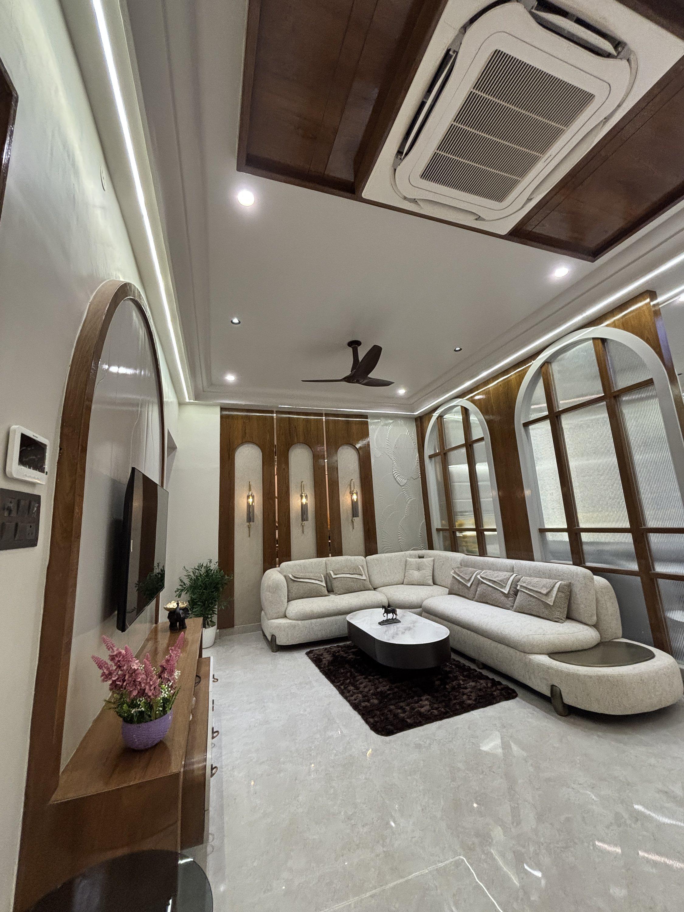 Living room with arched windows and curved sofa