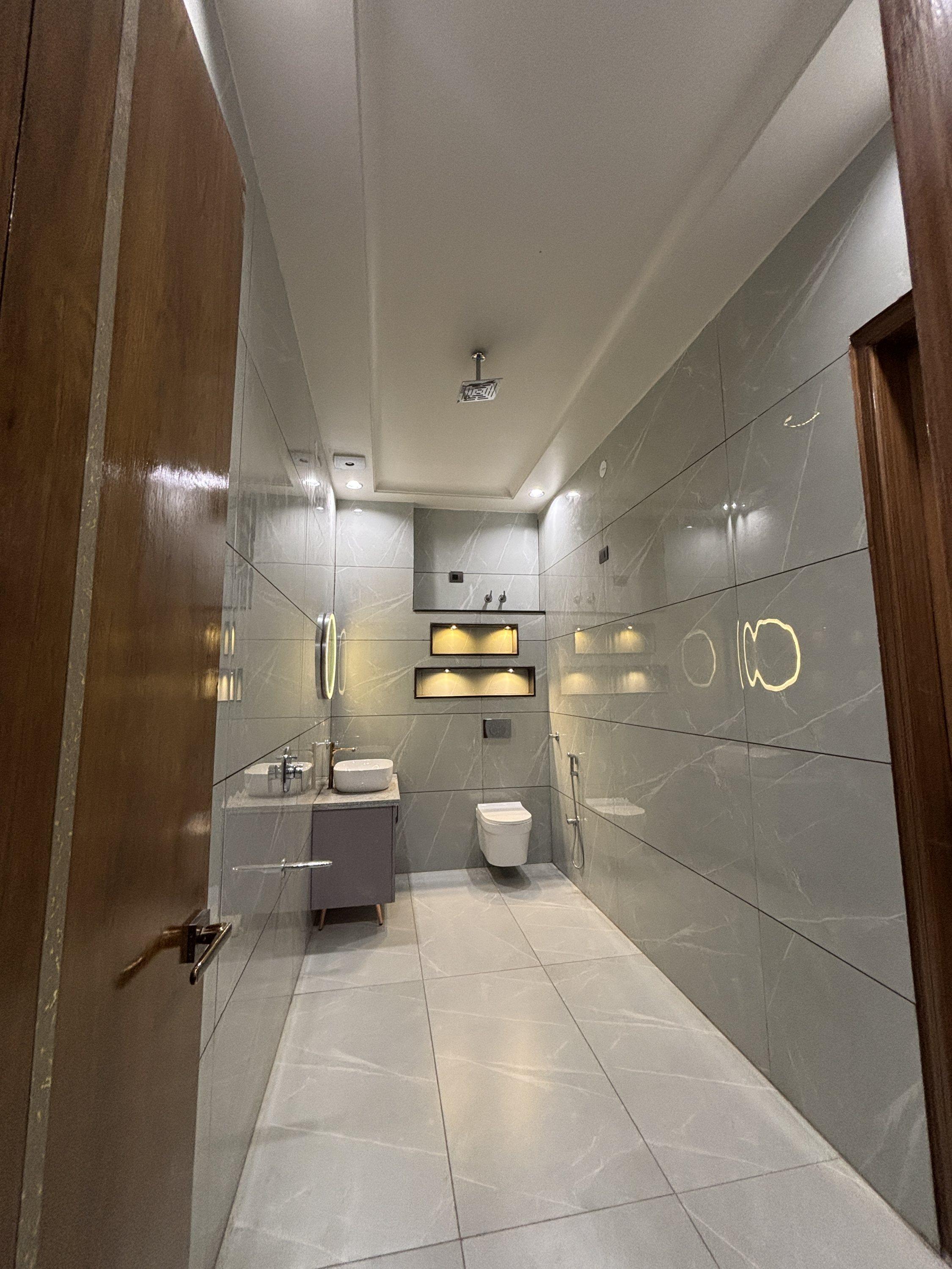 Bathroom with glass partition and premium fittings