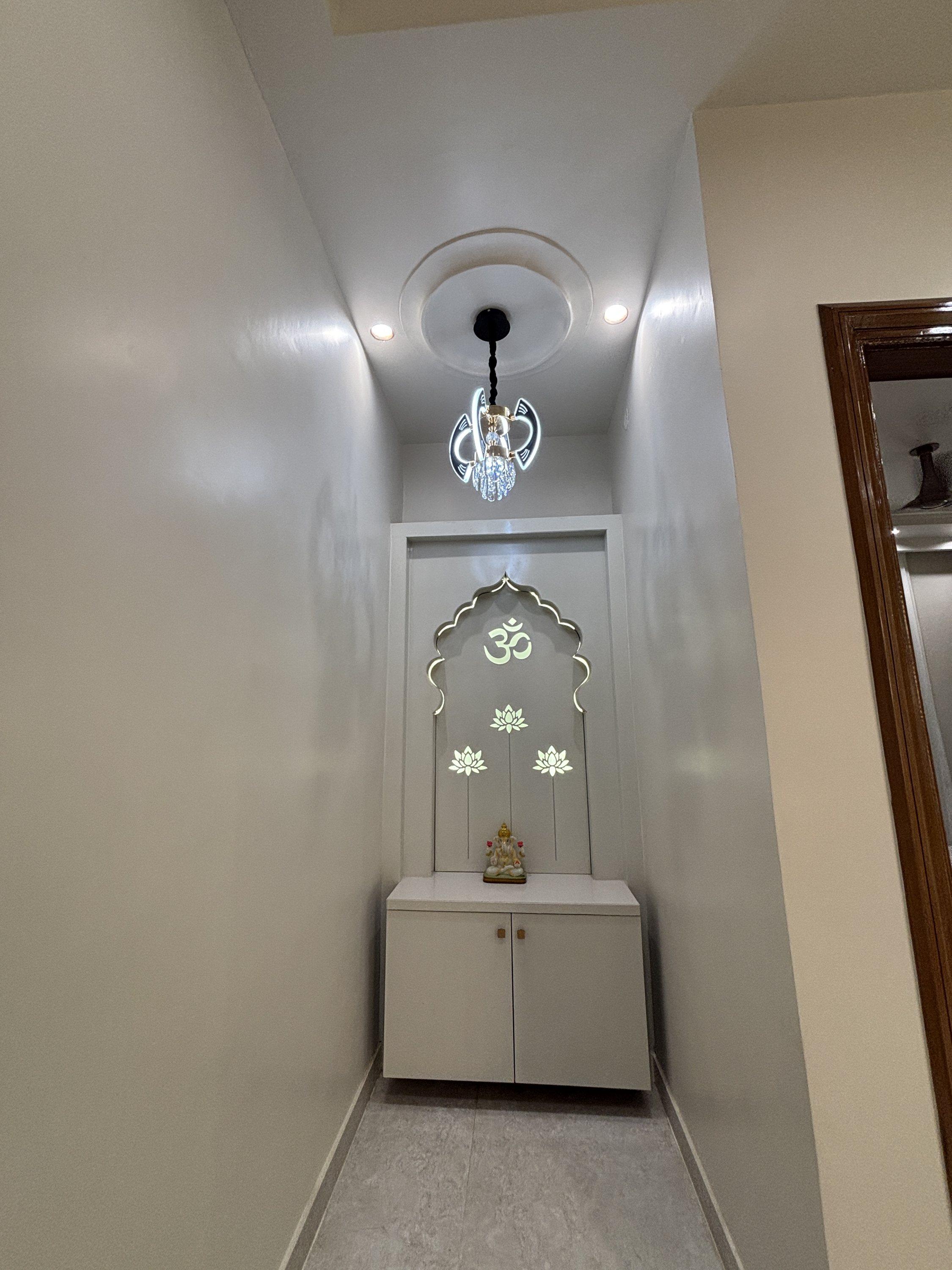 Pooja alcove with backlit design