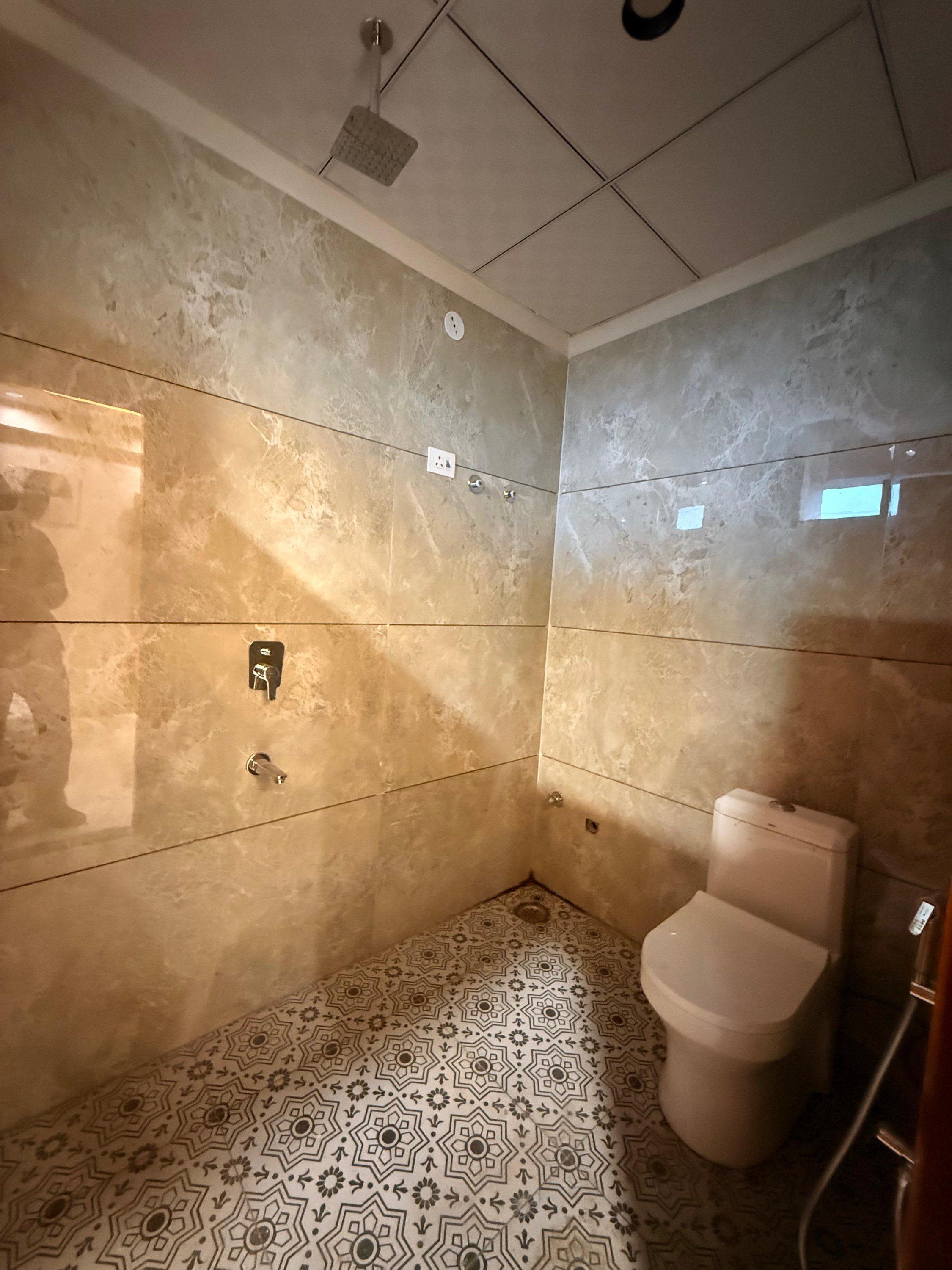 Bathroom with patterned floor tiles